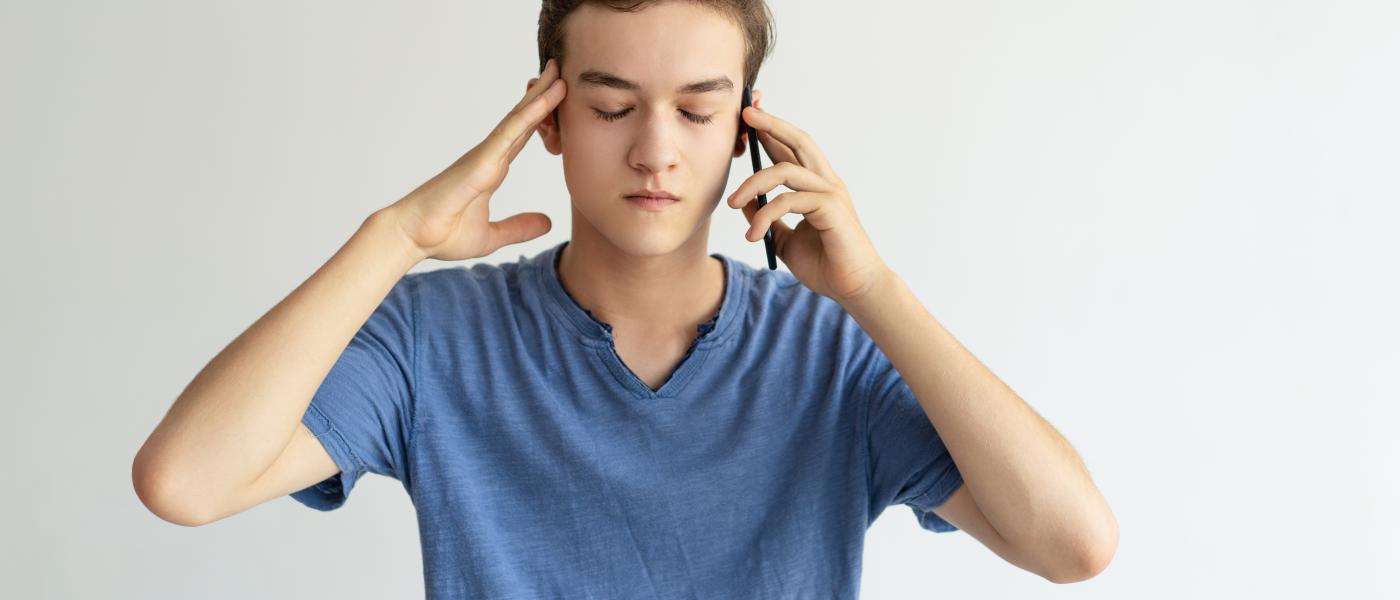 teen boy on cell phone