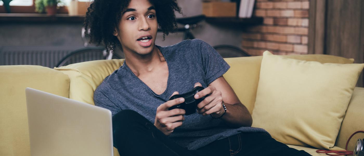 teen boy playing video games